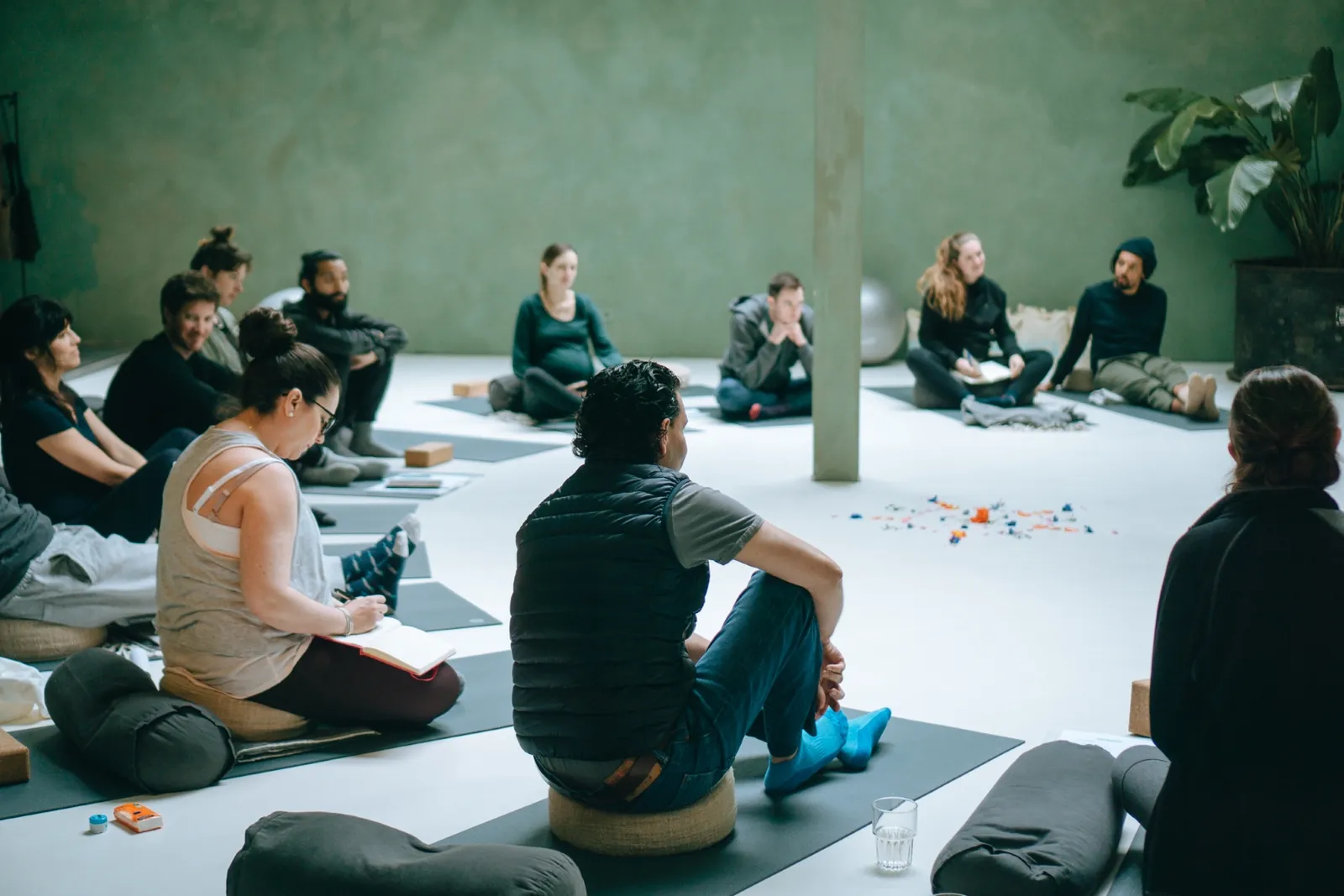 Participants on floor cushions during a Mamamoon prenatal workshop