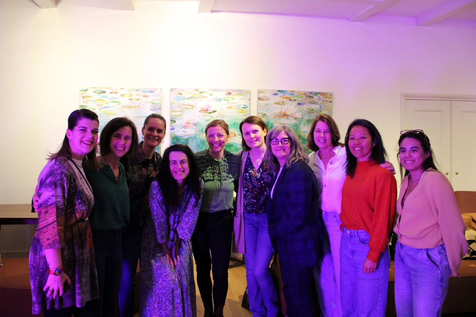 Speakers and guests posing together at a Mamamoon corporate event