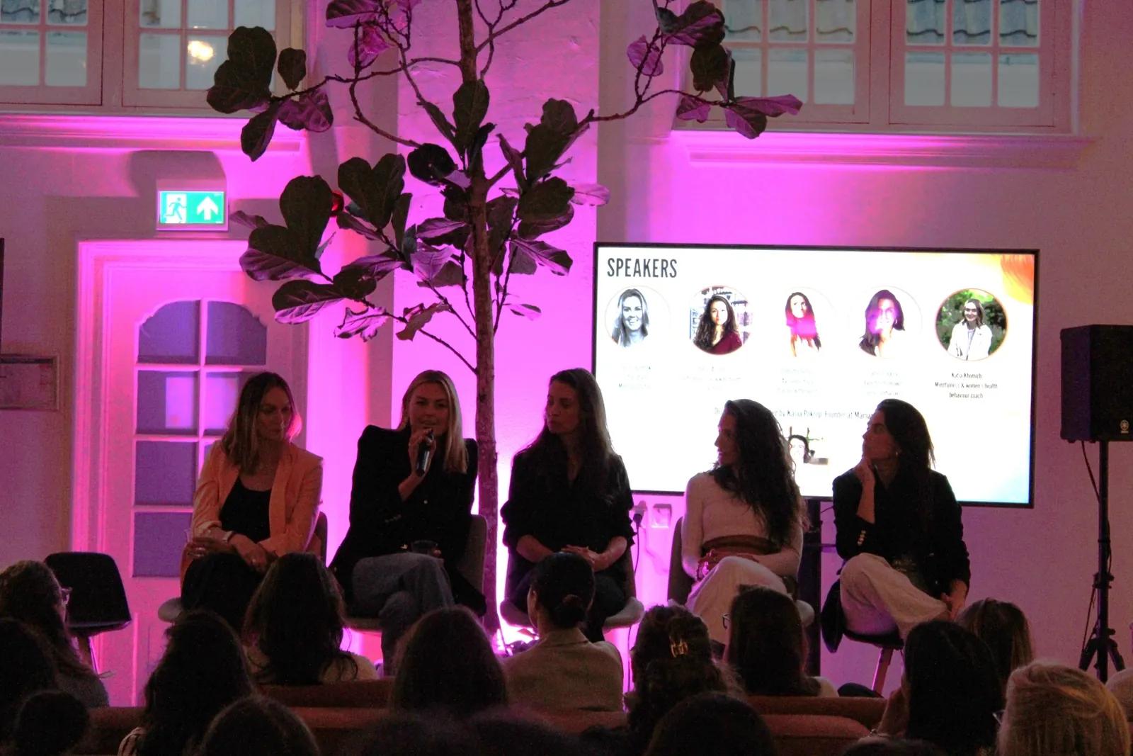 Panel discussion on stage at a Mamamoon corporate event