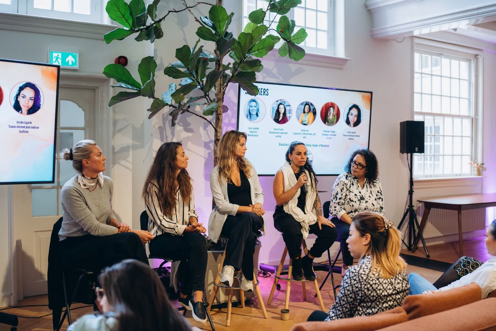 Panel of speakers answering questions at a Mamamoon event