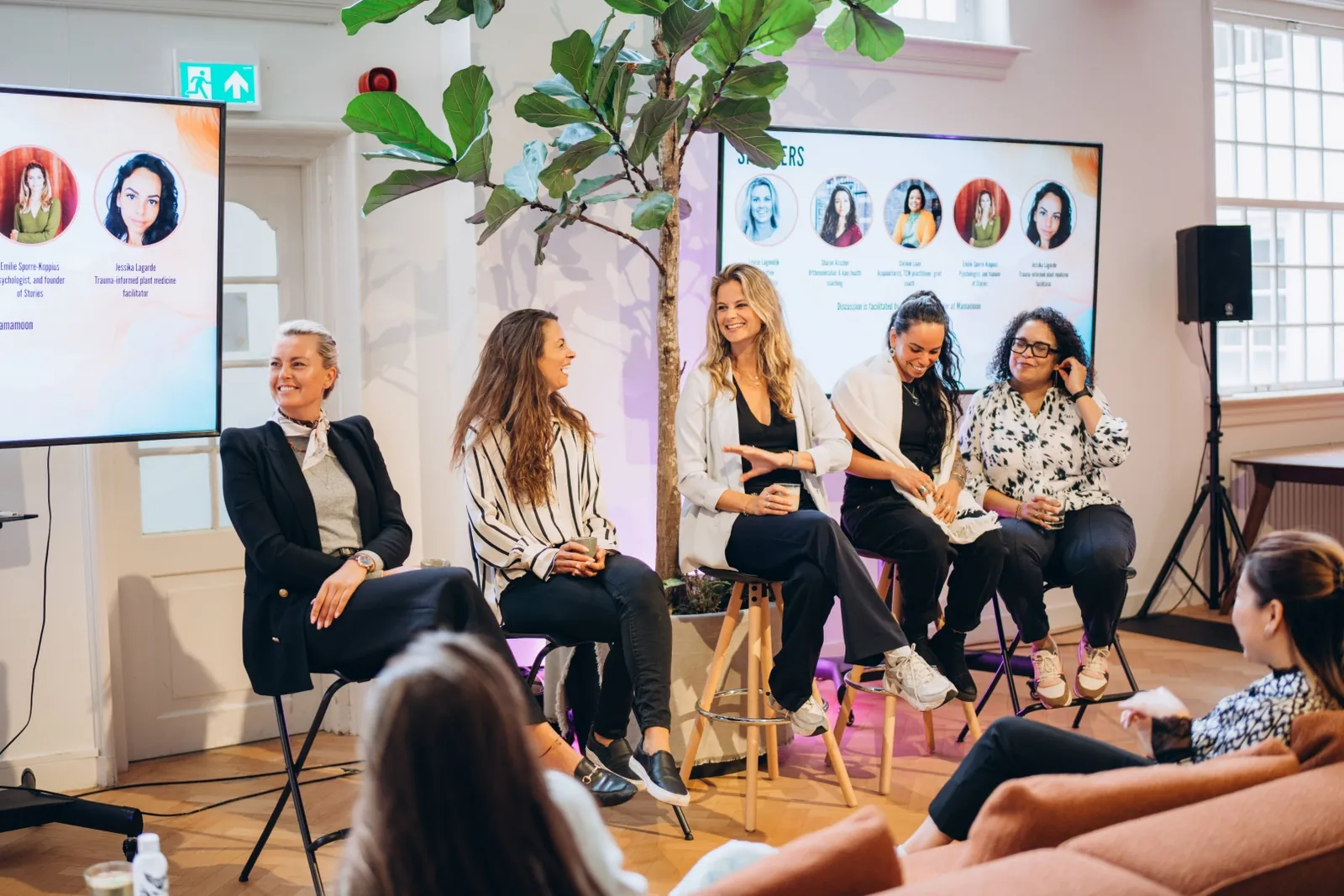 Panel on stage at a Mamamoon corporate event