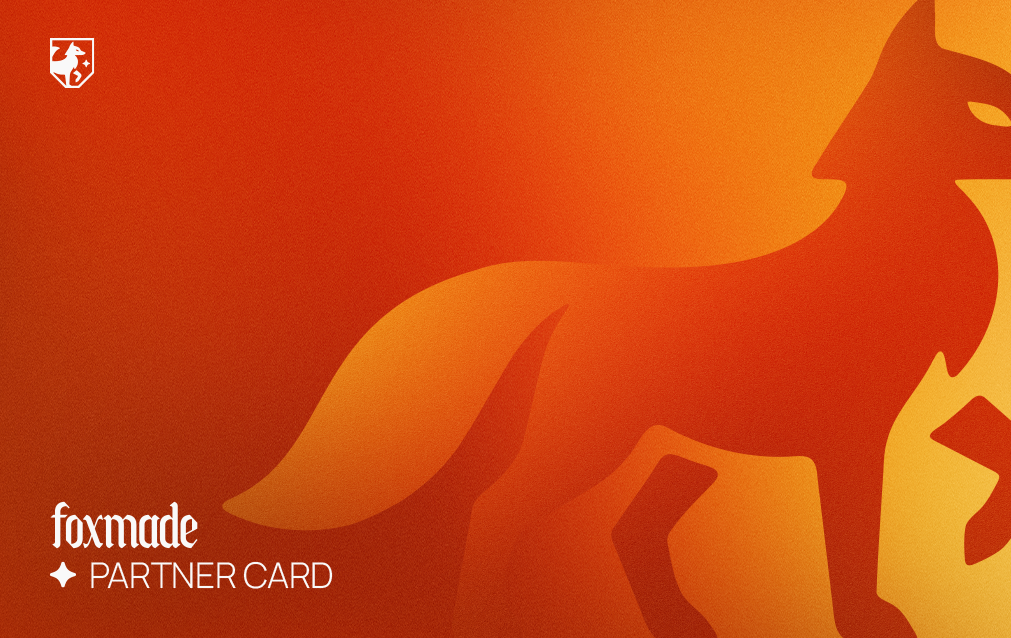 Orange fox silhouette on right with white Foxmade Partner Card text on left against gradient background.