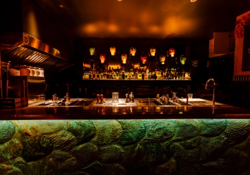 man cooking in a kitchen with flames