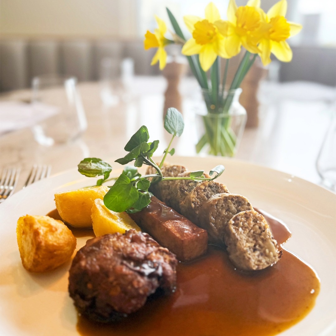 Sunday roast at The Goat with daffodils in the background.
