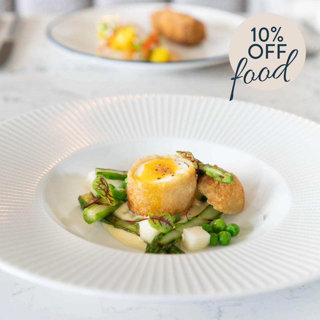 Elegant Scotch egg dish with asparagus and peas, served at The Goat restaurant Llandudno