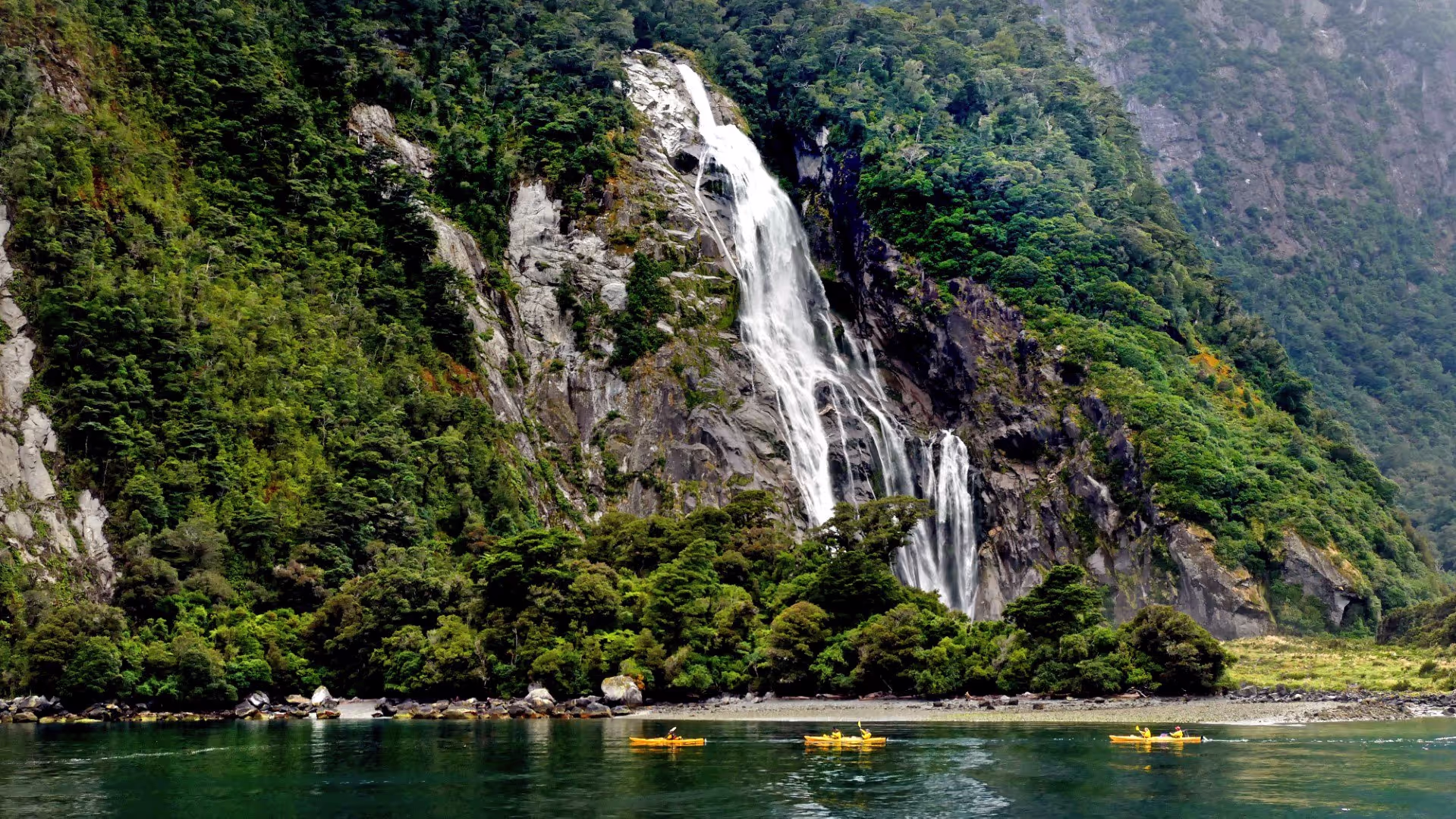 Sustainable tourism business being operated by Lady Bowen Falls in Milford Sound New Zealand