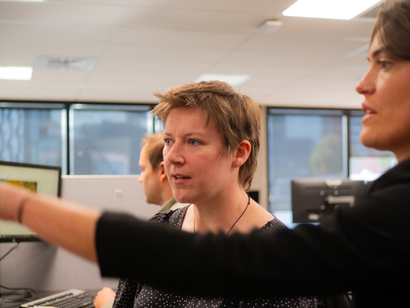 Two GIS professionals working to communicate data clearly through an ArcGIS storymap developed for local communities of Aotearoa New Zealand