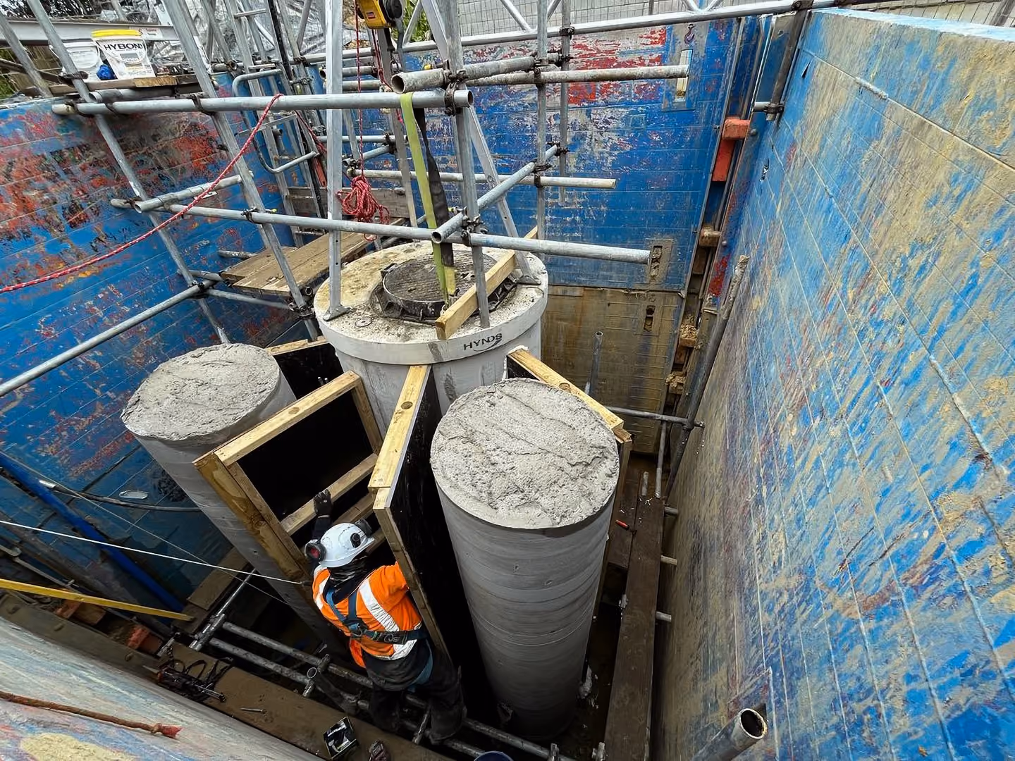 A stormwater manhole access shaft being constructed in a deep trench following Morphum Environmental's three waters engineering design