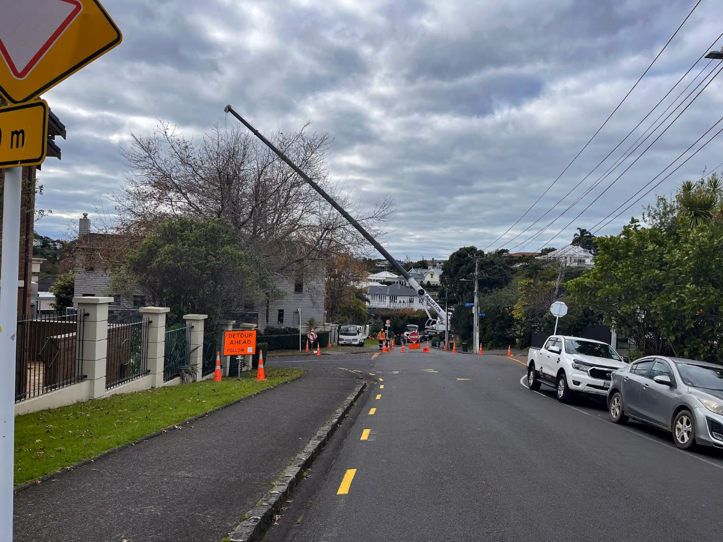 A crane lifting pipe infrastructure as part of a wastewater project in a local New Zealand community