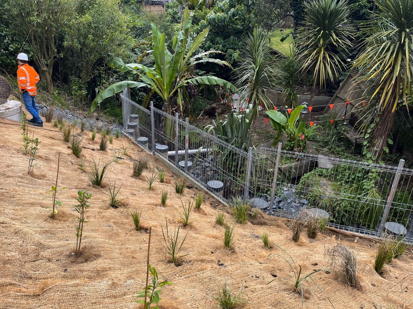 A planted hill with retaining walls and wastewater pipe bridge designed by Morphum engineers after the wastewater pipe failed