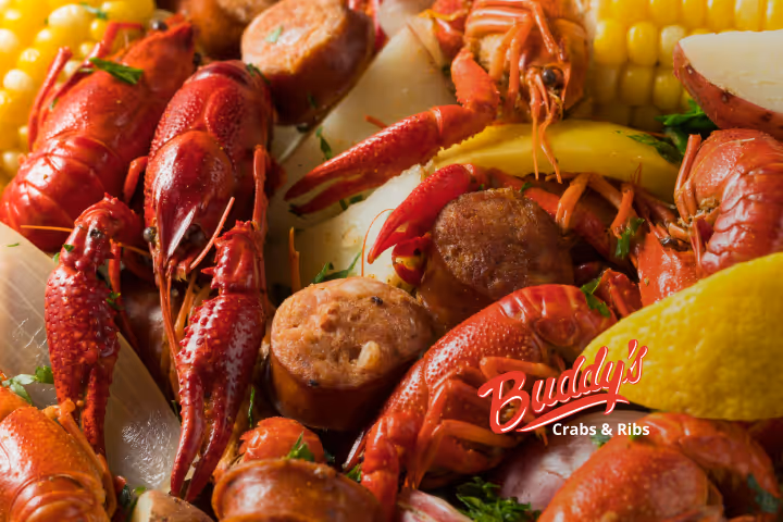 Guests enjoying seafood and waterfront views at Buddy’s Crabs & Ribs in Downtown Annapolis during Memorial Day Weekend, with patriotic decorations and Naval Academy families celebrating nearby.