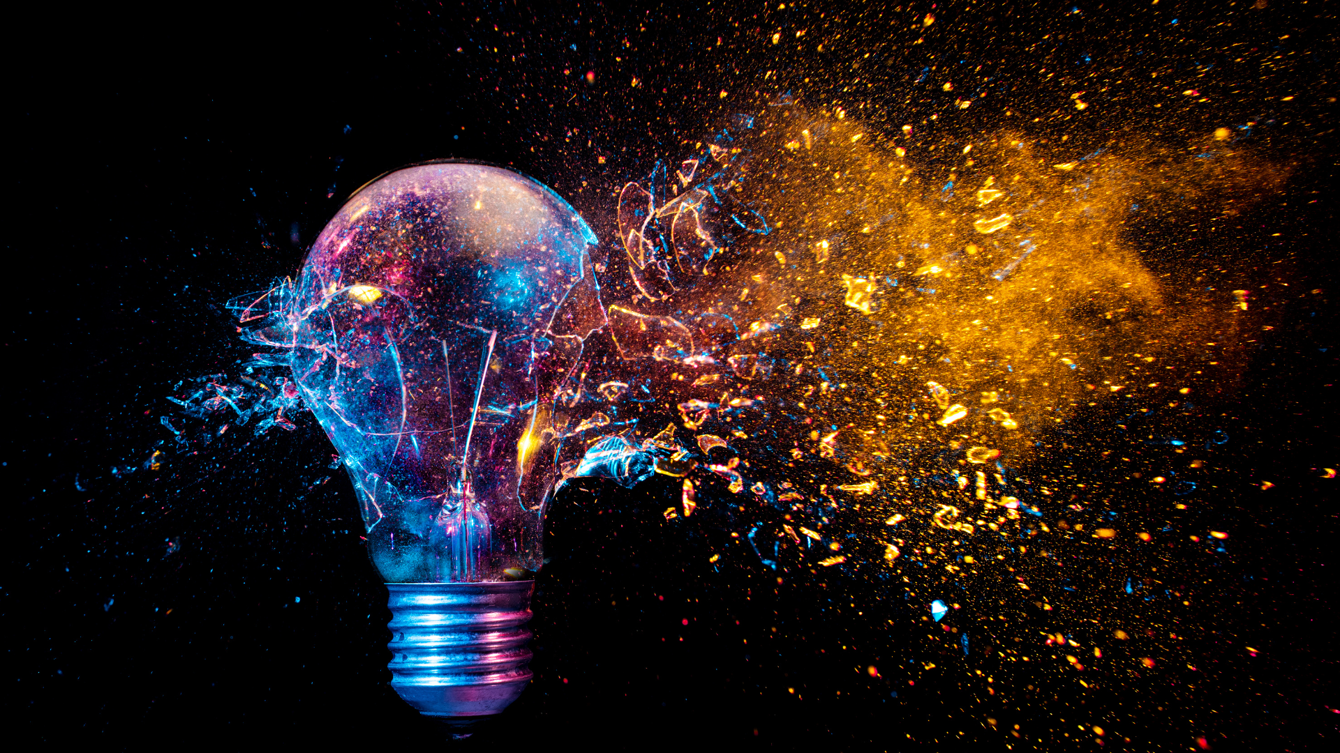 Exploding lightbulb with bright colors emerging, representing the spreading of new ideas