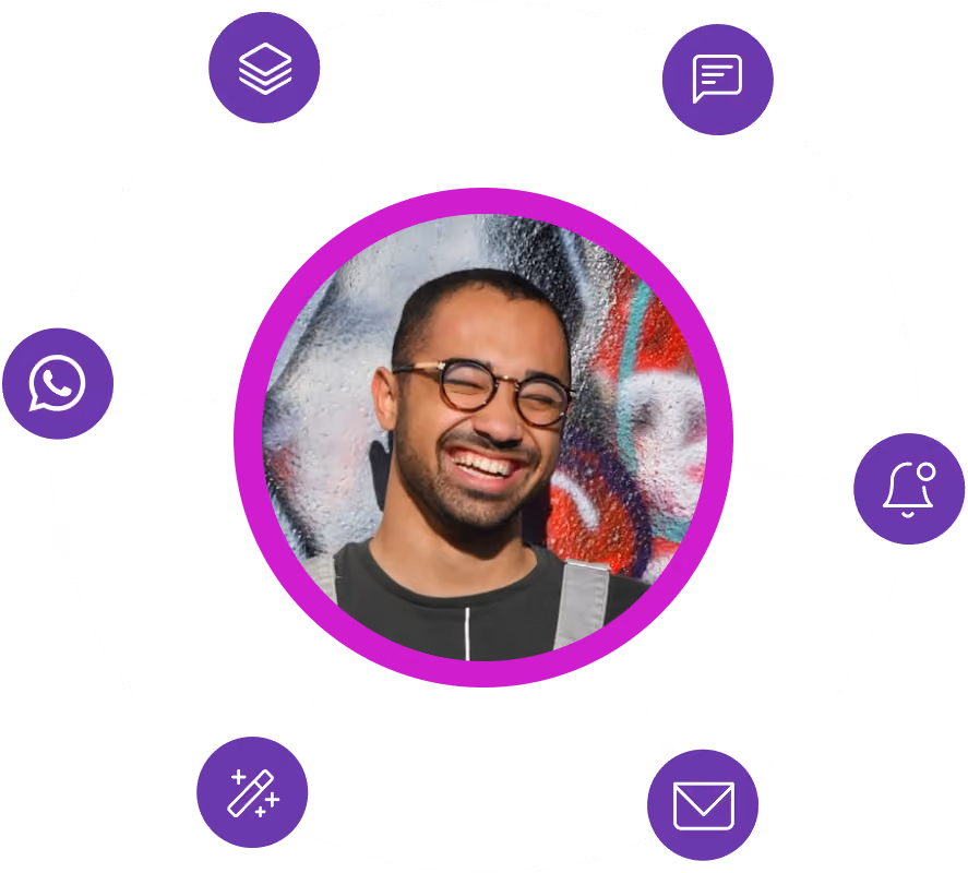 Smiling man with glasses and short hair in front of a colorful graffiti wall, surrounded by purple icons connected by dotted lines.