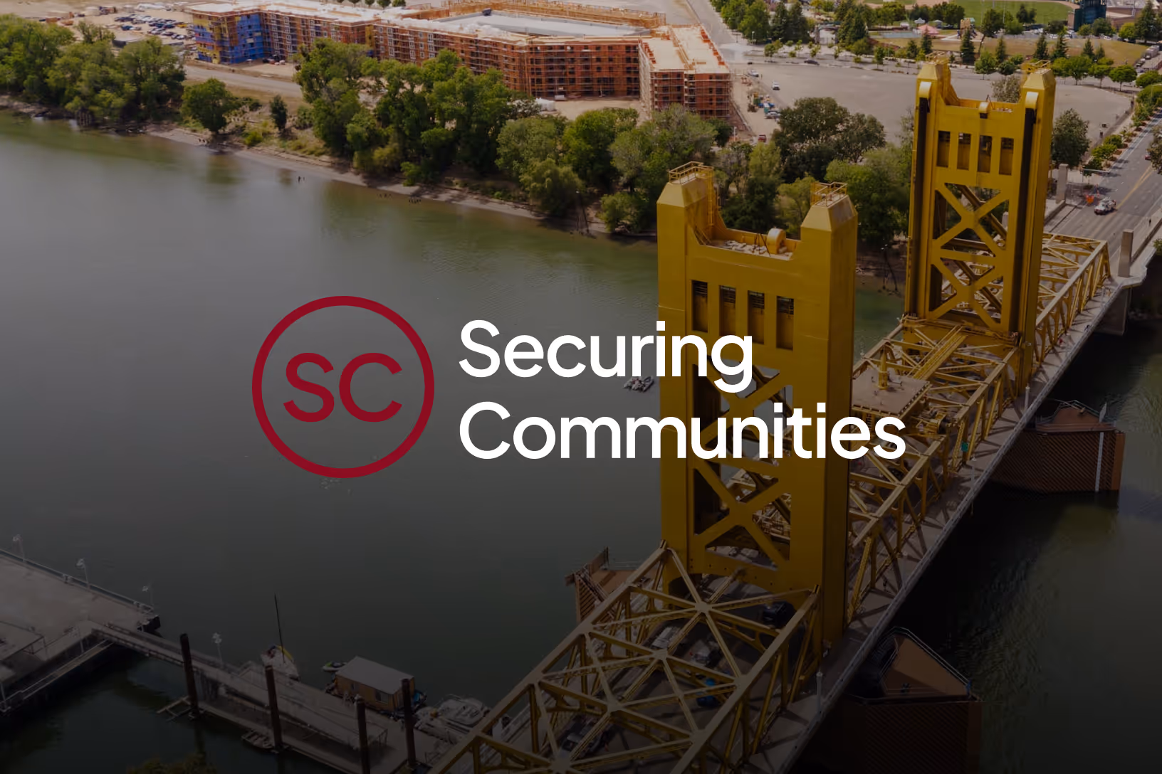 securing communities logo with bridge background