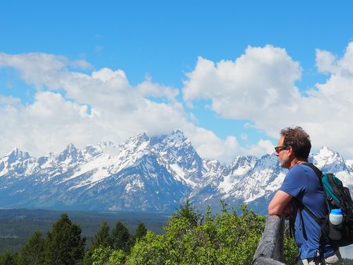 Person hiking with mountains in background