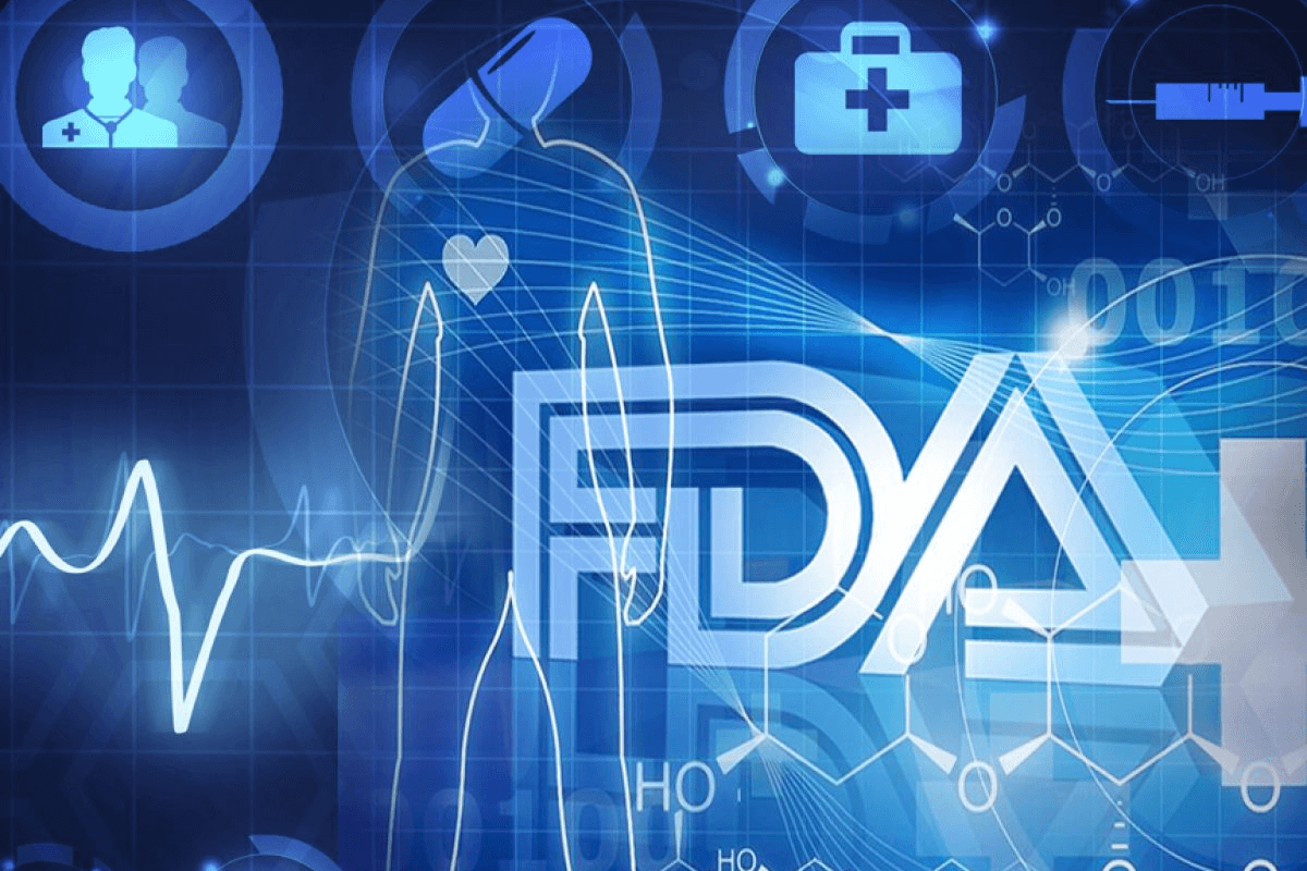 Blue digital medical background with FDA logo, human outline with heart icon, medical symbols, and heartbeat waveform.