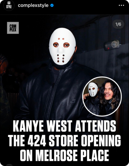 Person wearing a white mask with holes and a black leather jacket at the 424 store opening event.