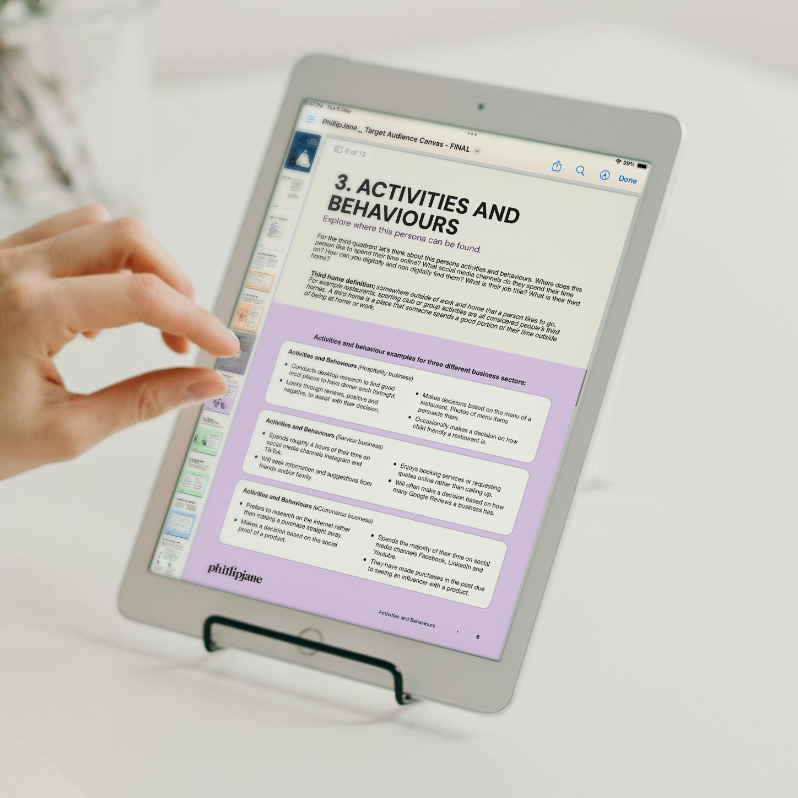 A person zooms in on their iPad to read more of the target audience canvas guide.