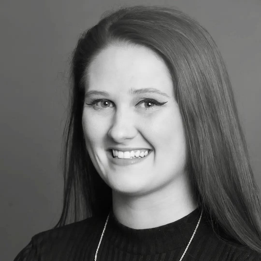 Black and white headshot of Nicki Dempsey