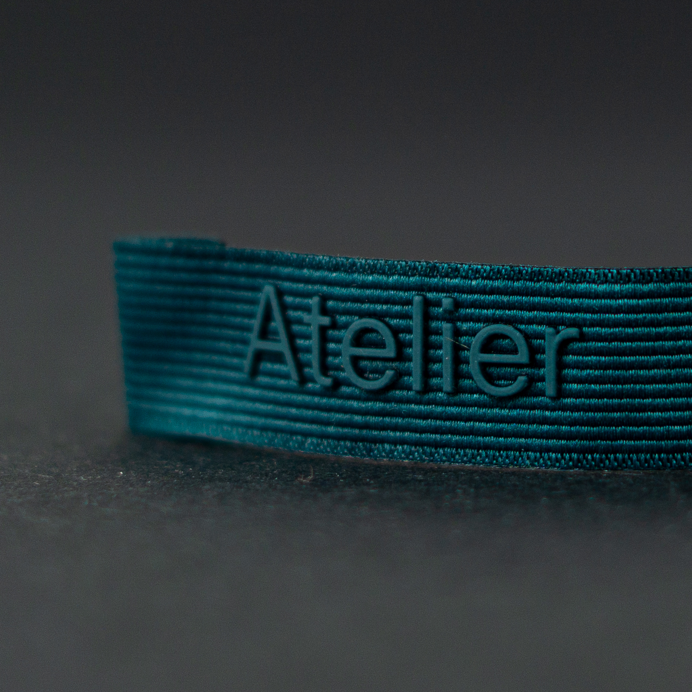 Ribbed dyed woven and silicon brand label