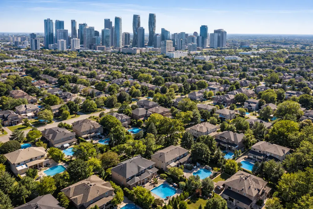 Drone aerial photo capturing Mississauga, Ontario residential areas and city skyline in the Greater Toronto Area.