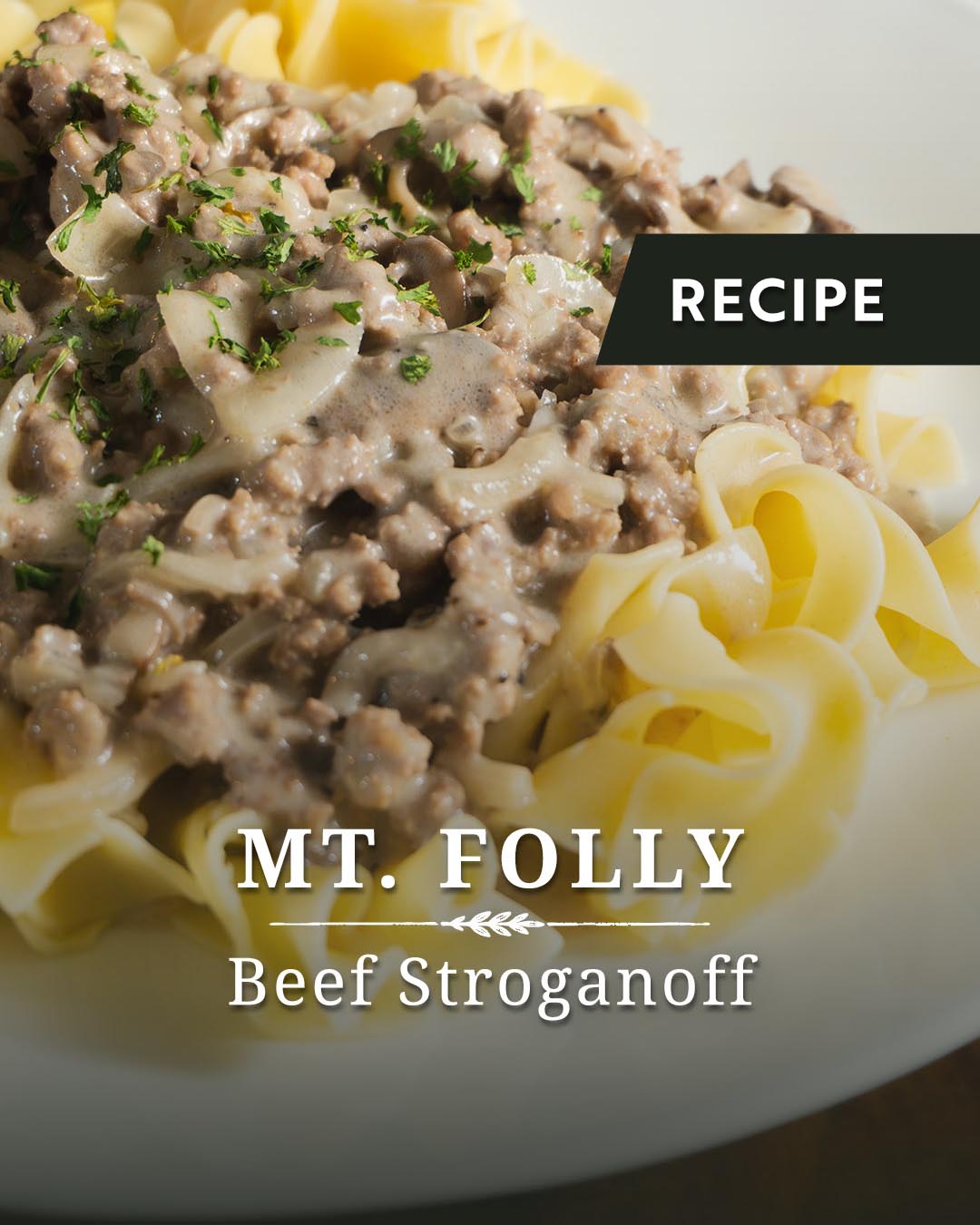 Recipe graphic for Mt. Folly Beef Stroganoff showing a close-up of creamy ground beef and mushroom sauce garnished with fresh parsley over a bed of extra-wide egg noodles.