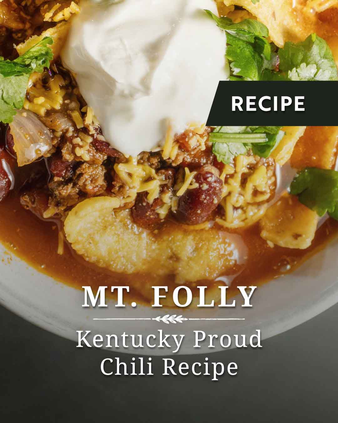 Mt. Folly Kentucky Proud Chili Recipe title graphic featuring a bowl of beef chili topped with sour cream, cheddar cheese, corn chips, and cilantro.