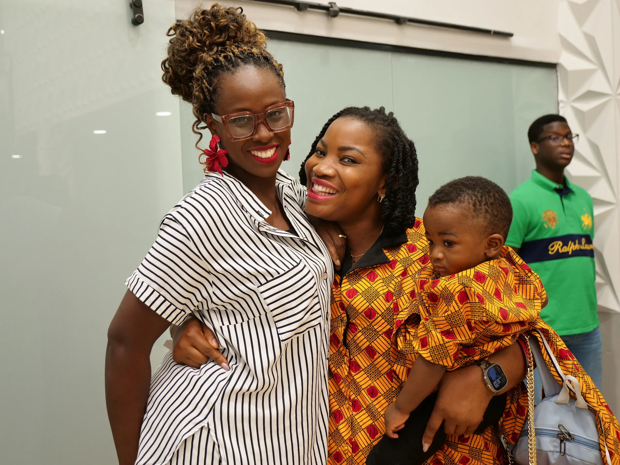 Women of Living Word Chapel together with a baby