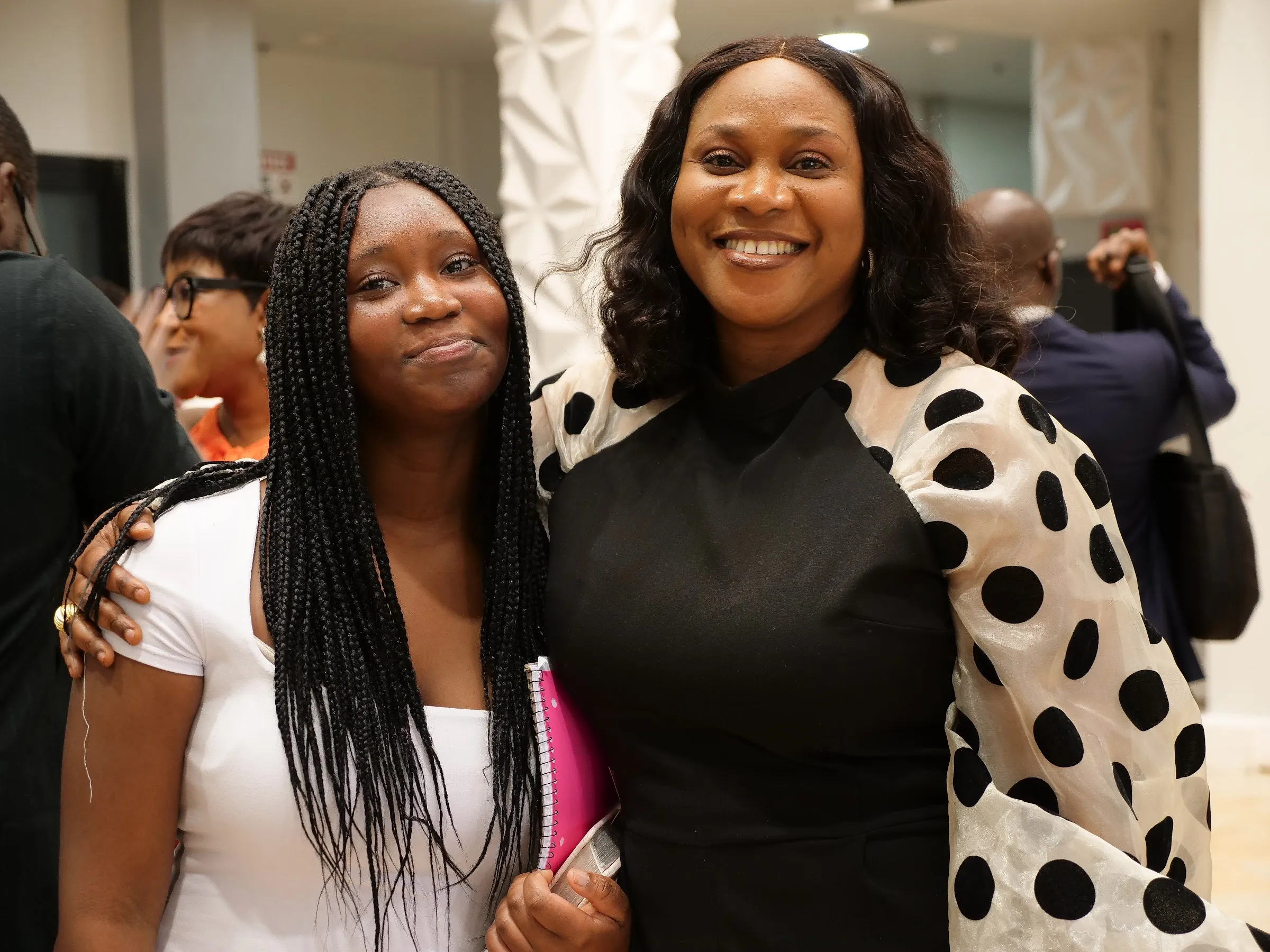 Two members of Living Word Chapel smiling together