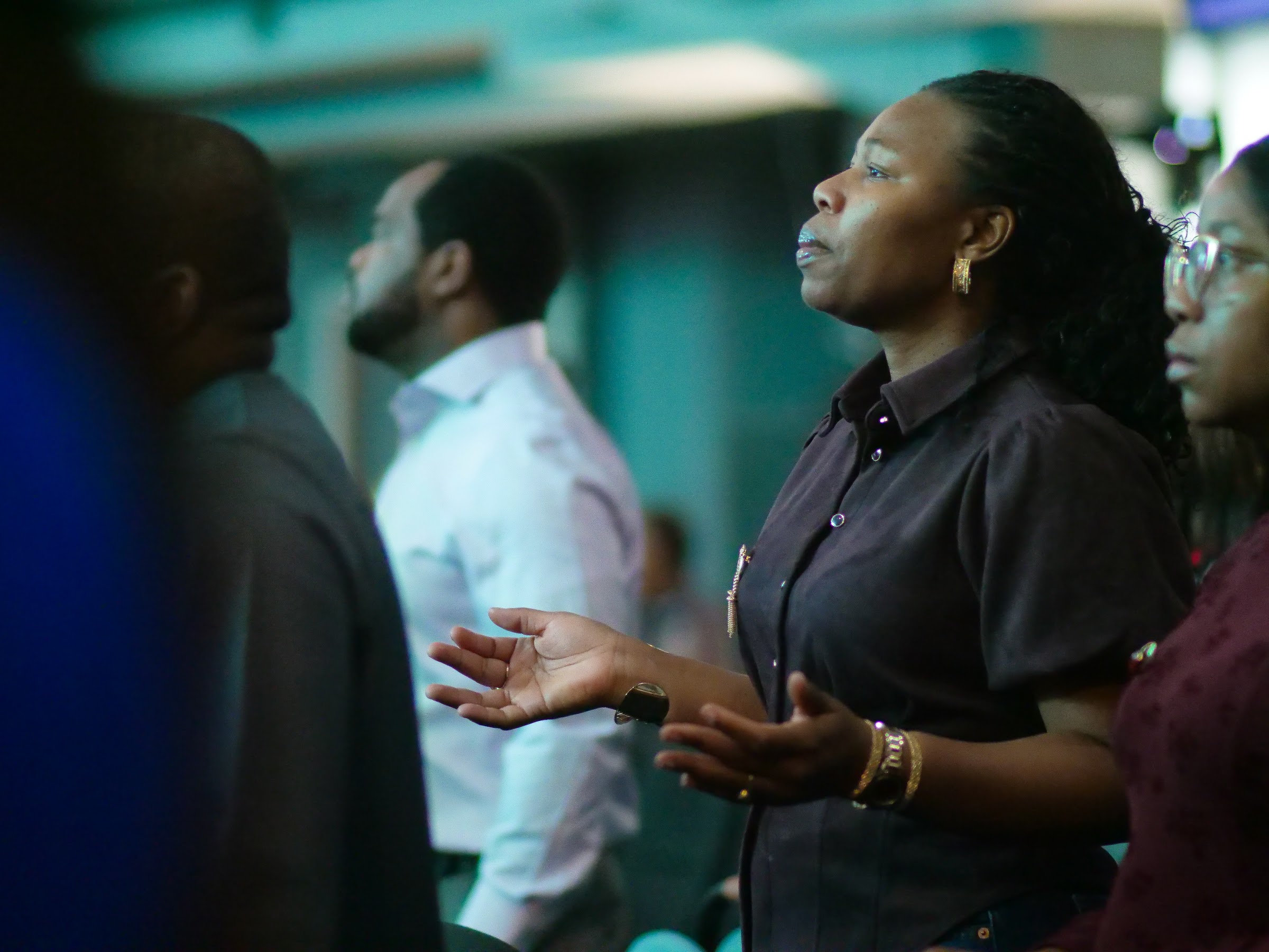 A member praying during service