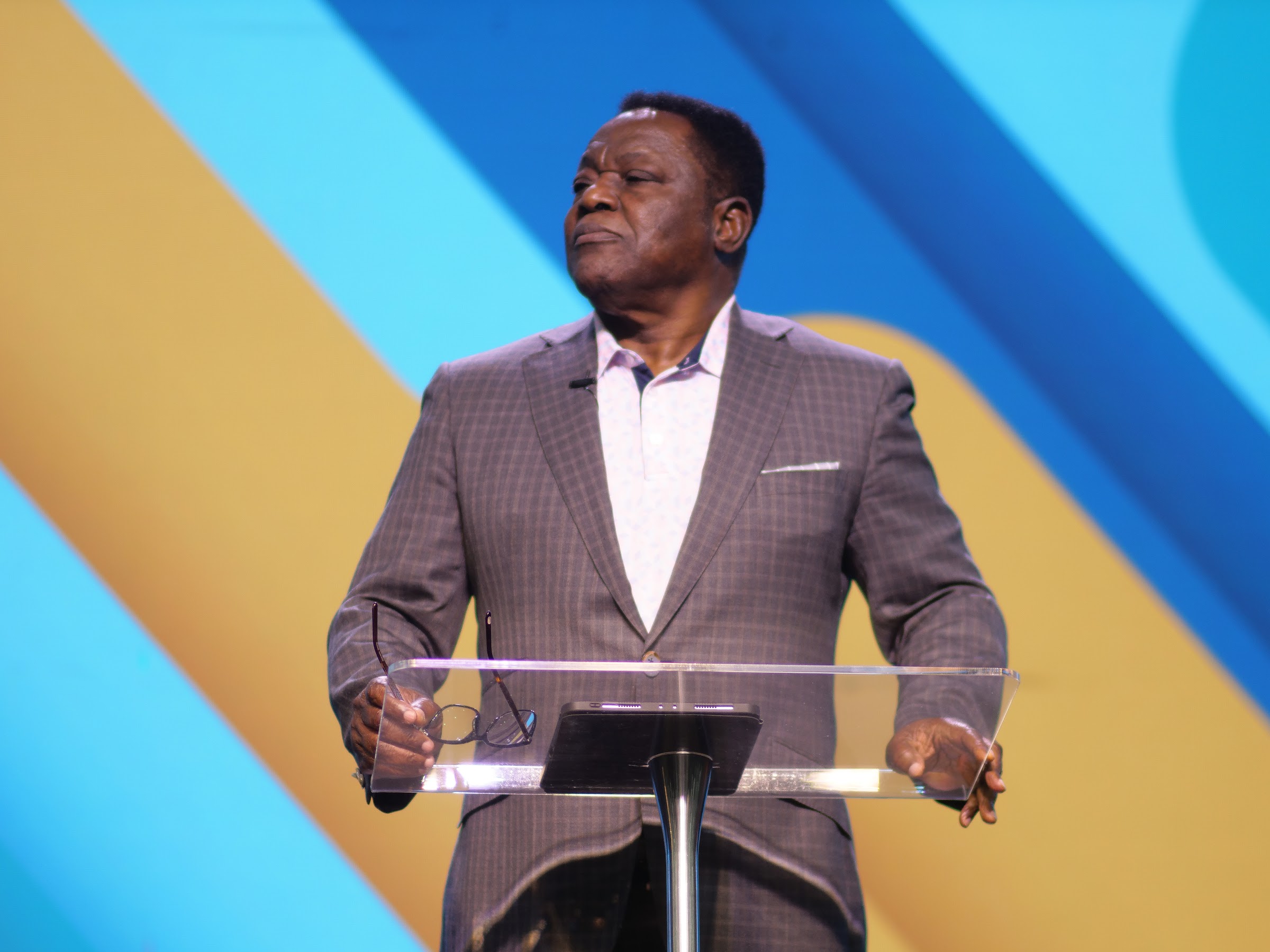 A minister preaching at Living Word Chapel