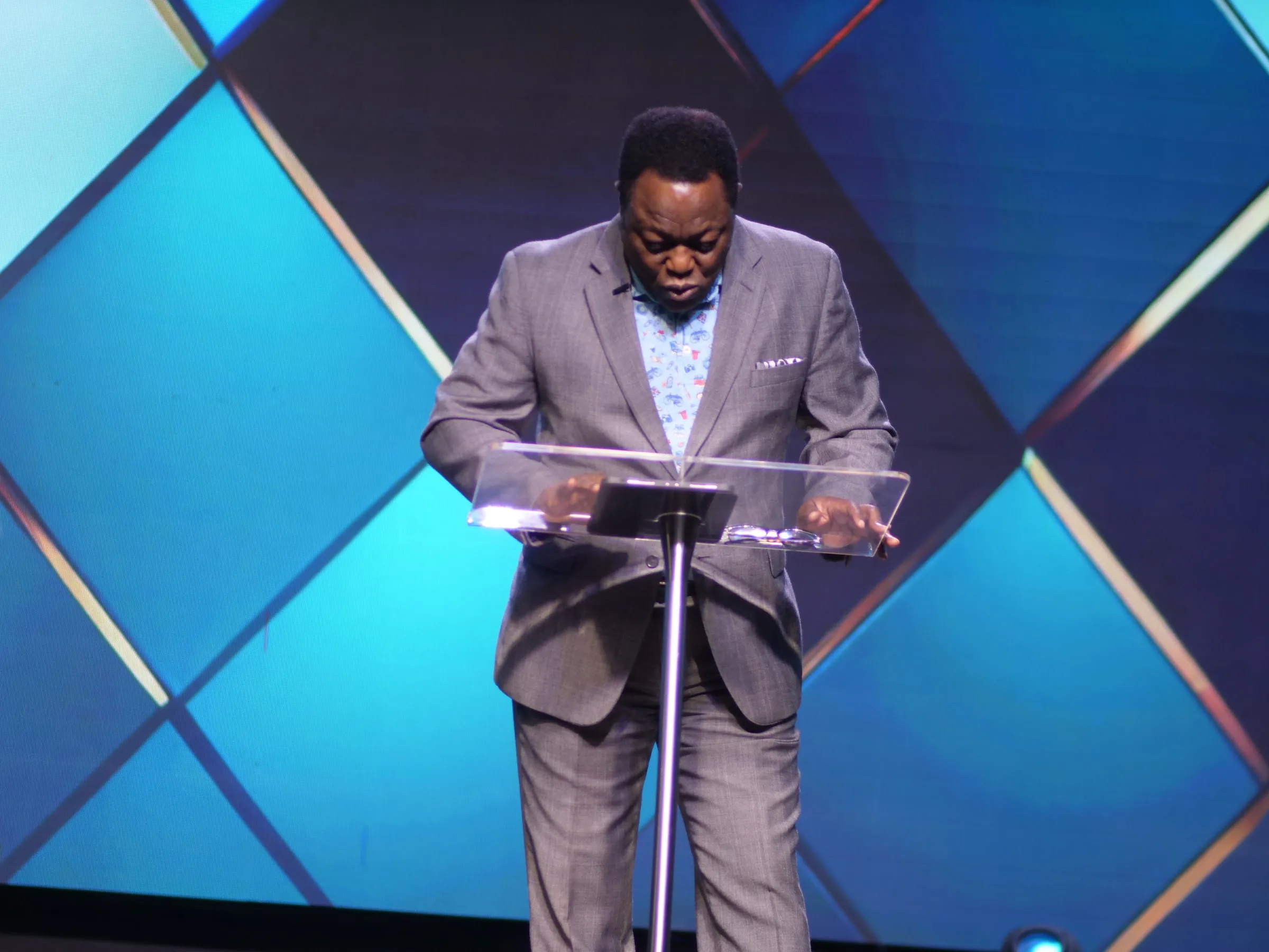 A minister preaching at Living Word Chapel