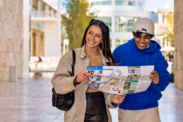 Young people walking around the Getty Museum with a map