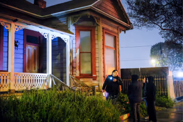 Tour guide explaining a haunted house