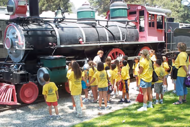 Kids looking at a train