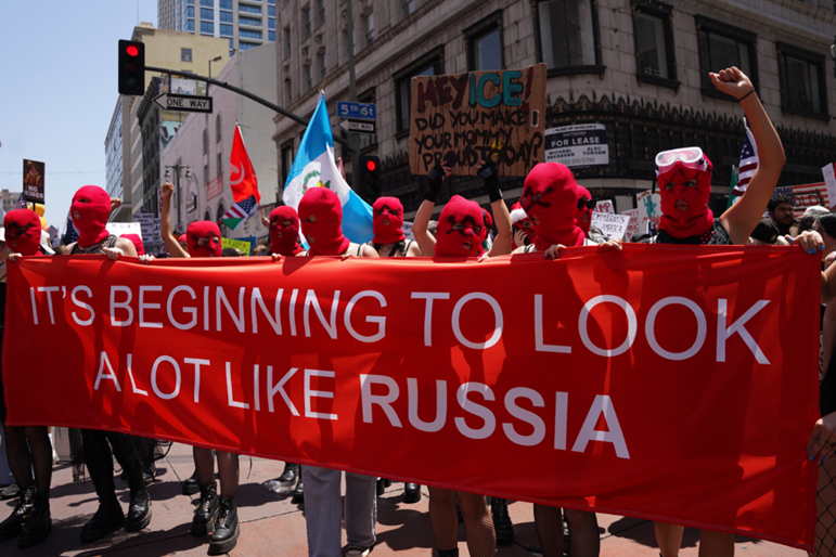 A group of people holding a banner