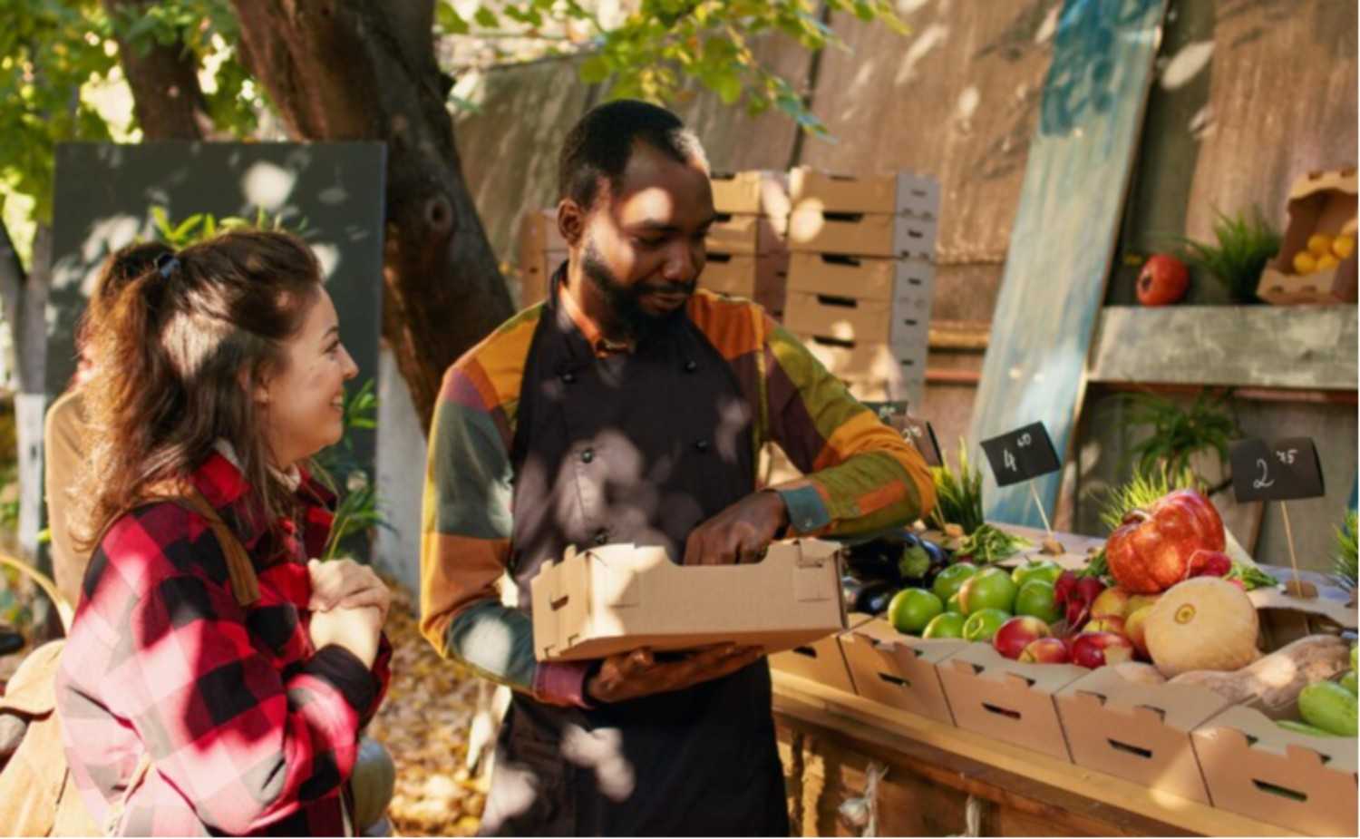 Couple standing in pumpkin field