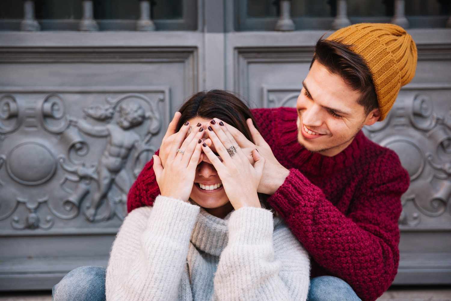Man closing eyes woman during the cuffing season