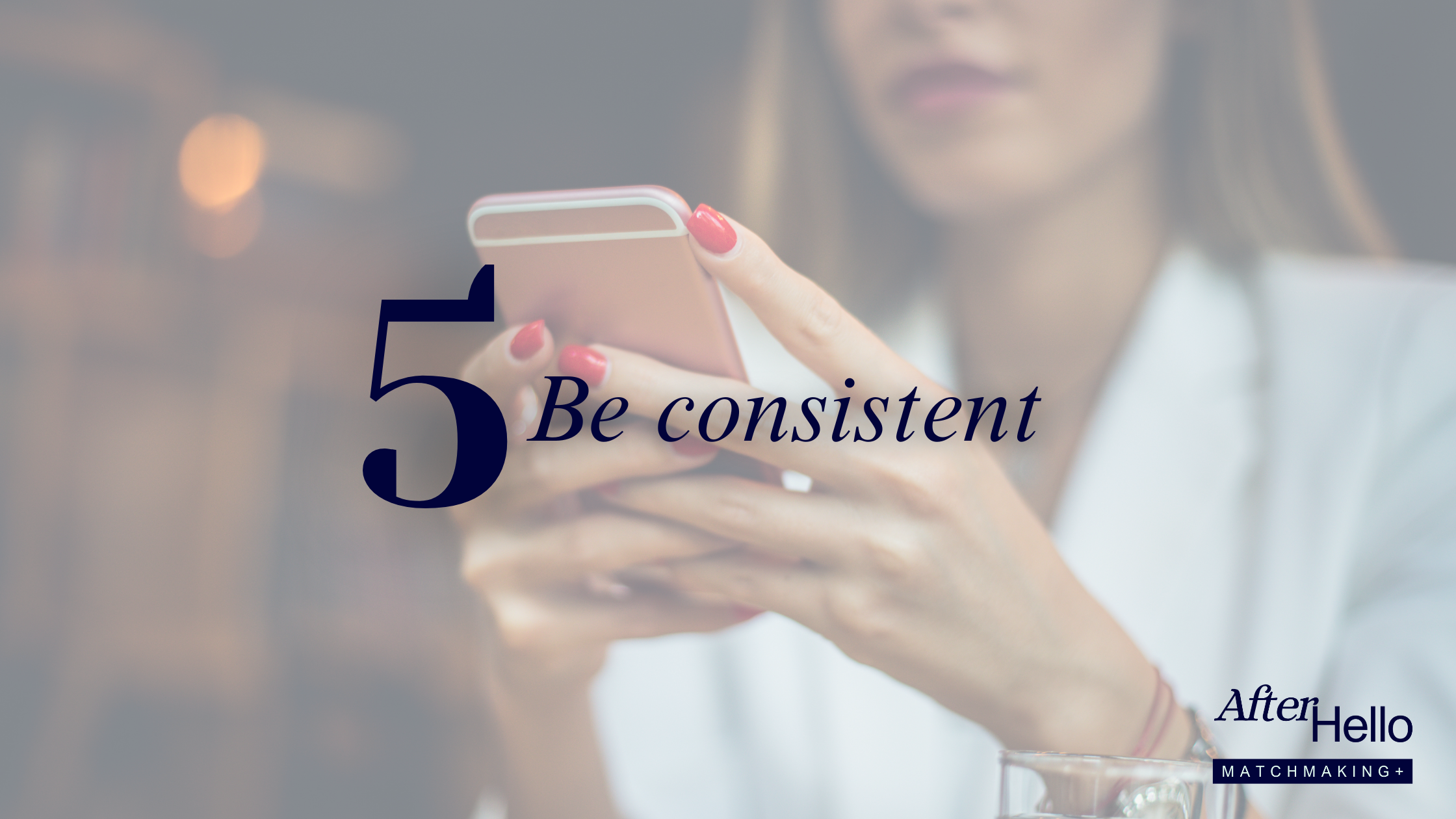 Woman checking her phone at a café, representing consistent and intentional dating app use for building meaningful connections.