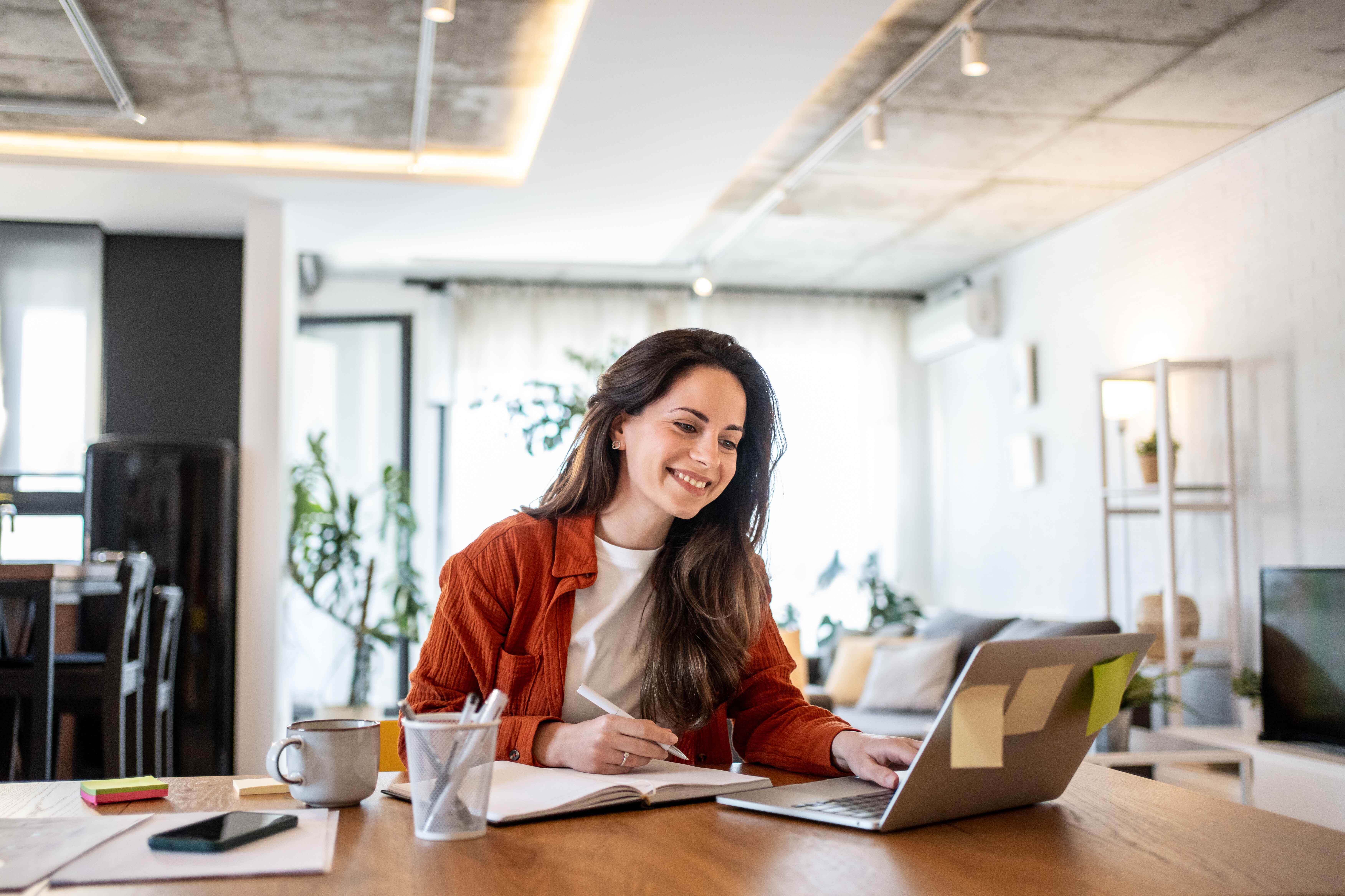 Woman attending a virtual matchmaking consultation from home on her laptop