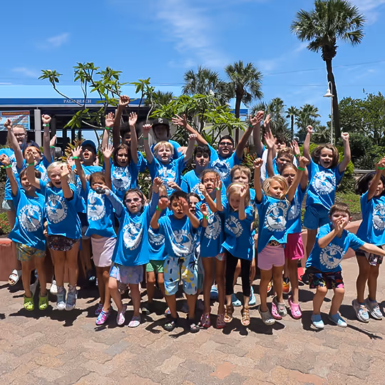 A group of kids learning at camps in Galveston, Texas at Moody Gardens