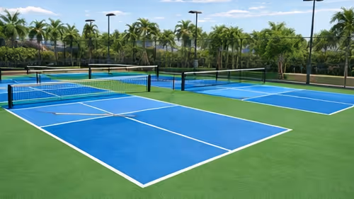 A young, female golfer prepares her swing by looking downward at the ball with her club resting near it on the bank of a sand trap. 
