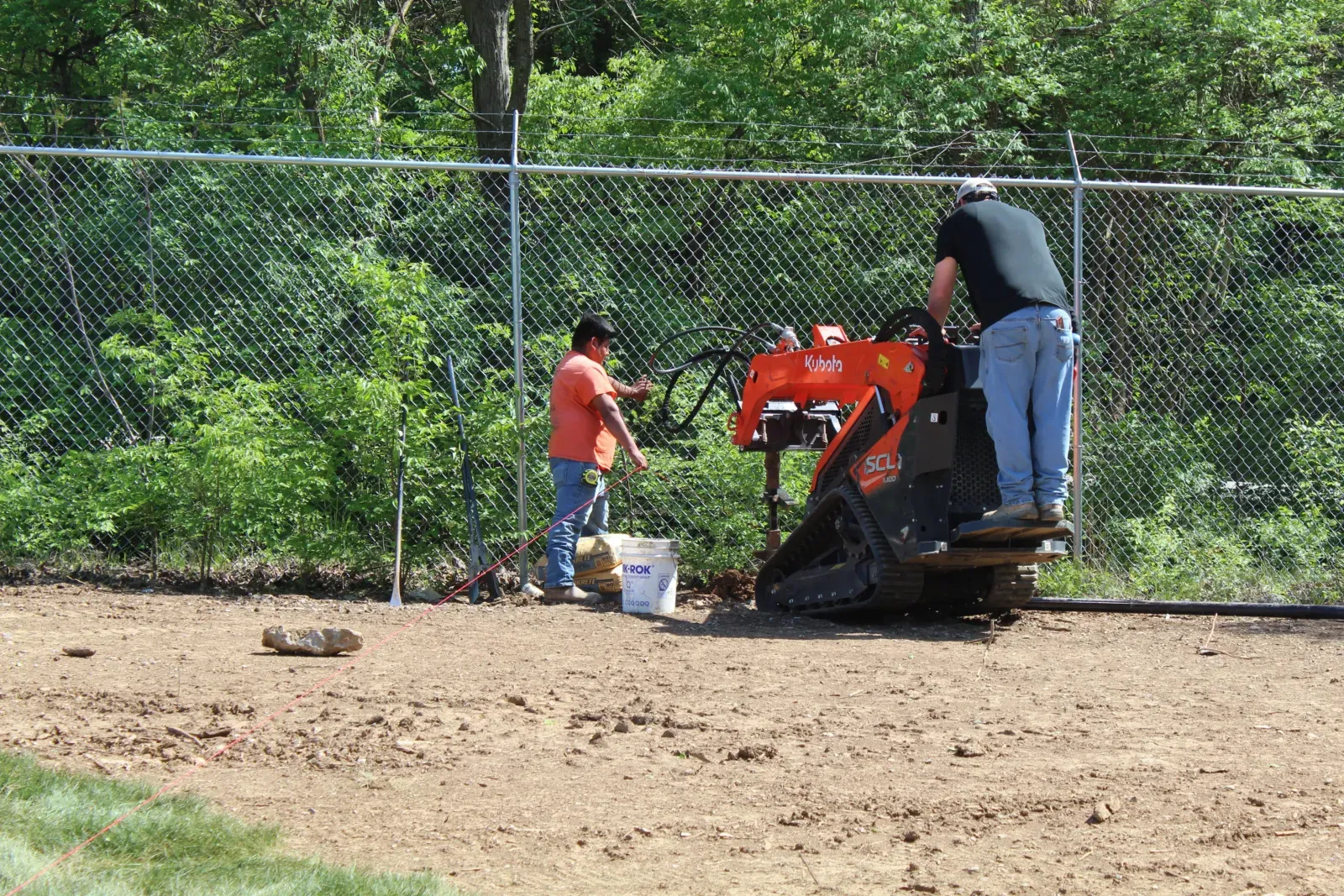 Rio Grande Fence Company installation crew building a commercial security fence