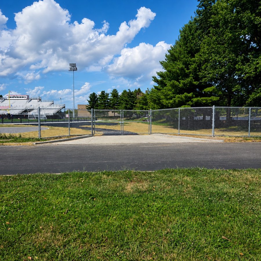 Galvanized chain-link double gate at Dunbar High School football field in Lexington, Kentucky