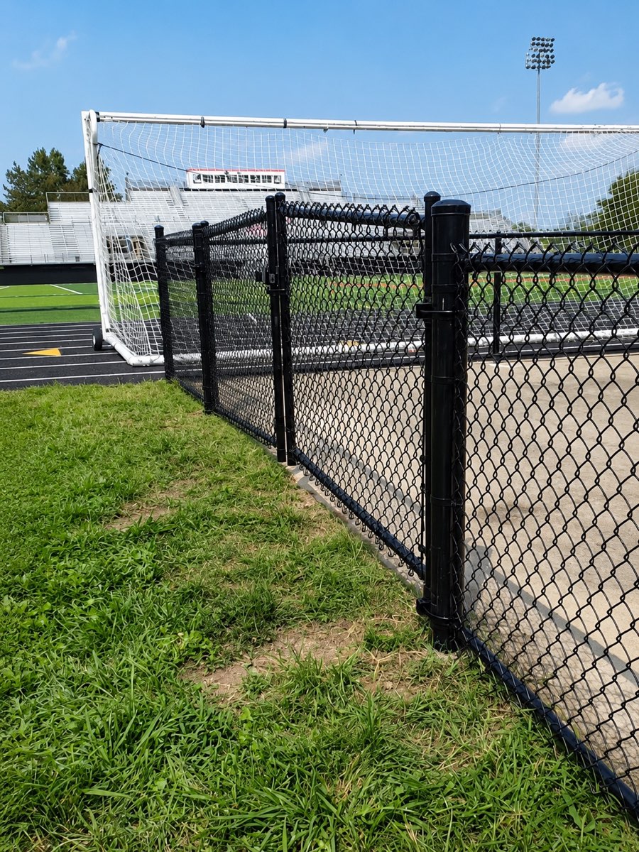 Black vinyl-coated chain-link athletic field fence installed in Lexington, Kentucky by Rio Grande Fence Company
