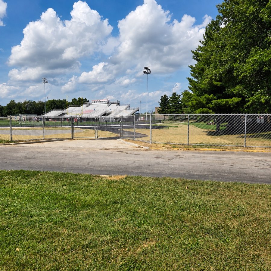 Chain-link football field entrance gate at Paul Laurence Dunbar High School in Lexington, Kentucky
