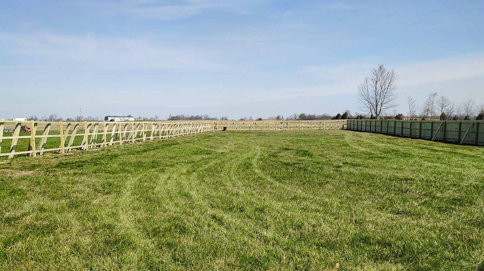 Wide view of a completed treated wood fence project in Mount Sterling, Kentucky