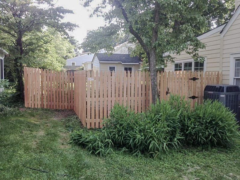 Wide view of the cedar garden entrance and adjoining fence in Midway.