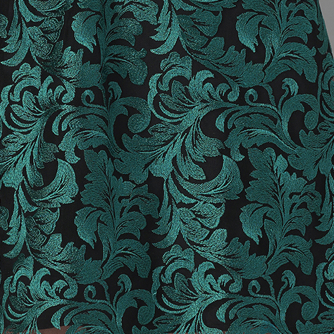 A close up of a green and black dress.