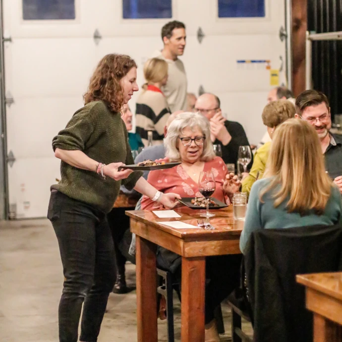 People enjoying food and wine 